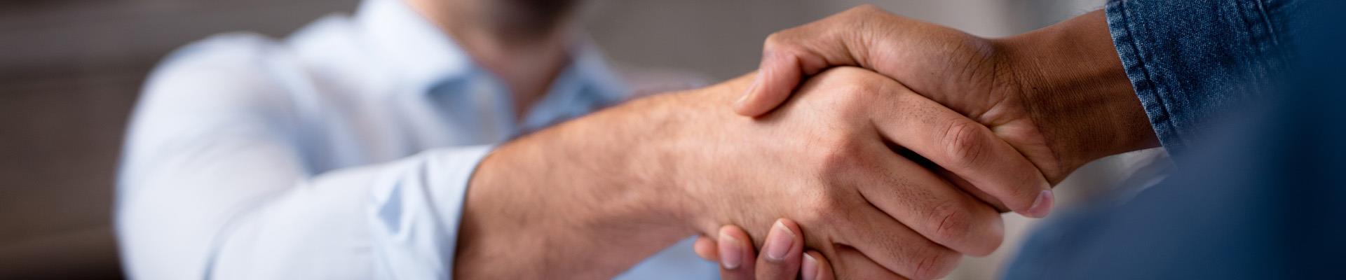 two men shaking hands